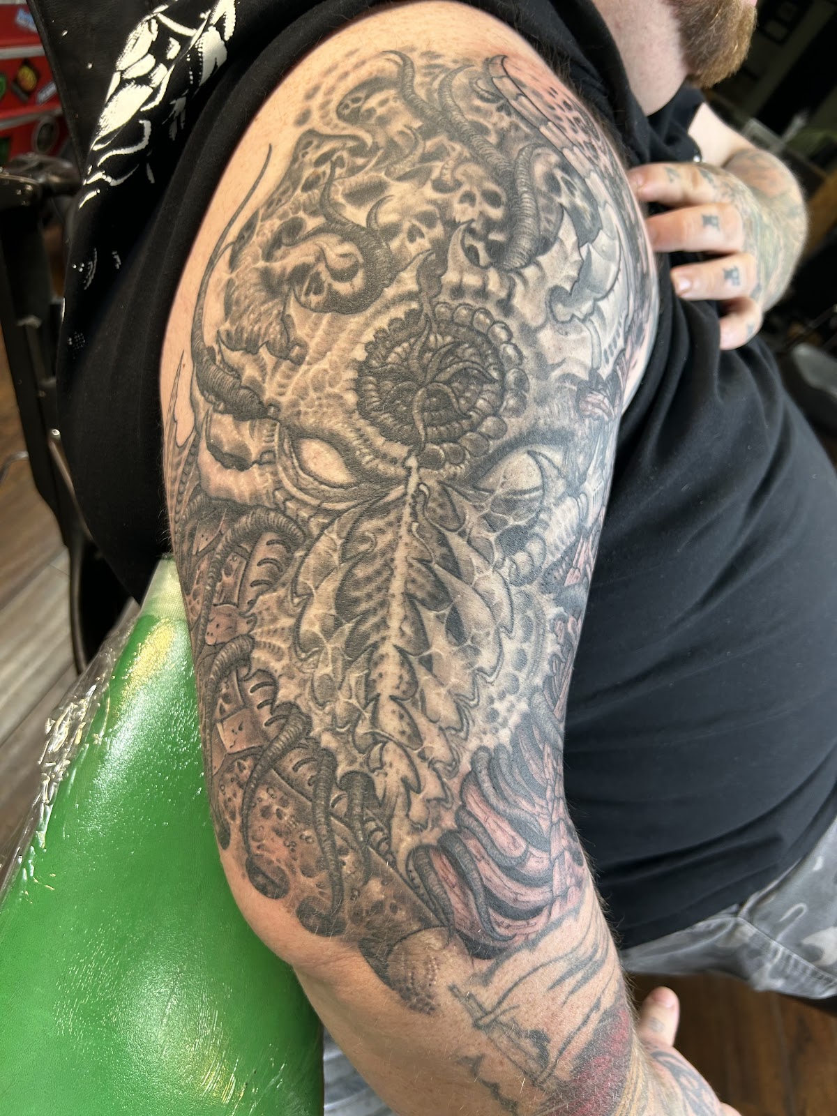 Biomechanical skull sleeve in progress at Coffin City Tattoo